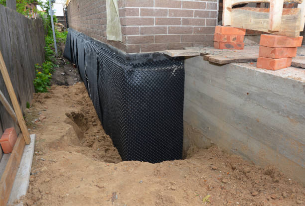 Happy homeowners after waterproofing job in Louisville